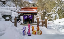 Size: 2048x1260 | Tagged: safe, photographer:pakapaka1993, autumn blaze, starlight glimmer, sunset shimmer, tempest shadow, kirin, pony, unicorn, g4, buddhism, guanyin, irl, japan, photo, plushie, rock, shrine, snow, tree, vase, winter