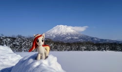 Size: 2048x1212 | Tagged: safe, photographer:pakapaka1993, oc, oc only, oc:poniko, earth pony, pony, cloud, earth pony oc, irl, japan, mountain, photo, plushie, snow, solo, tree, winter