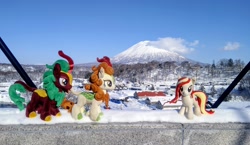 Size: 2048x1185 | Tagged: safe, photographer:pakapaka1993, autumn blaze, cinder glow, summer flare, oc, oc:poniko, earth pony, kirin, pony, g4, earth pony oc, female, irl, japan, mare, mountain, photo, plushie, snow, trio, winter