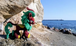 Size: 2048x1237 | Tagged: safe, photographer:pakapaka1993, cinder glow, summer flare, kirin, pony, g4, irl, japan, ocean, photo, plushie, rock, solo, water