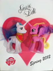 Size: 1529x2048 | Tagged: safe, princess cadance, shining armor, a canterlot wedding, g4, official, 2012, artifact, brushable, facebook, heart, irl, male, my little pony logo, photo, pony history, ship:shiningcadance, shipping, straight, toy