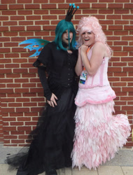 Size: 1969x2592 | Tagged: safe, artist:flufflepam, queen chrysalis, oc, oc:fluffle puff, human, g4, brick wall, changeling wings, clothes, cosplay, costume, dress, duo, irl, irl human, photo, queen chrysalis' crown, wings