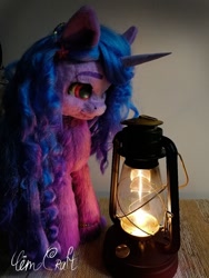 Size: 960x1280 | Tagged: safe, artist:limecraft, artist:limecraft27, izzy moonbow, pony, unicorn, g5, cute, female, irl, lantern, looking at something, mare, photo, plushie, solo