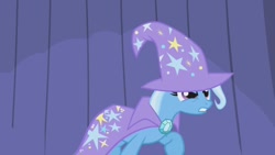 Size: 1280x720 | Tagged: safe, screencap, trixie, pony, unicorn, boast busters, g4, season 1, brooch, cape, clothes, female, gritted teeth, hat, jewelry, mare, raised hoof, solo, trixie is not amused, trixie's brooch, trixie's cape, trixie's hat, unamused