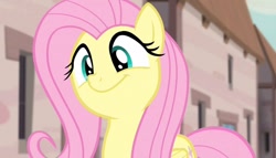 Size: 1258x720 | Tagged: safe, screencap, fluttershy, pegasus, pony, g4, season 5, the cutie map, :t, blurry background, cute, female, flutterbob, happy, in our town, mare, outdoors, party soft, shyabetes, smiling, solo