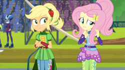 Size: 3410x1920 | Tagged: safe, screencap, applejack, fluttershy, lemon zest, sunny flare, equestria girls, g4, my little pony equestria girls: friendship games, duo, duo female, duo focus, female, goggles, helmet, high res, offscreen character, roller skates