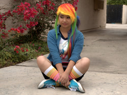 Size: 1725x1294 | Tagged: safe, artist:eri-nyan, rainbow dash, human, equestria girls, g4, 2015, clothes, converse, cosplay, costume, irl, irl human, multicolored hair, photo, rainbow hair, shoes, sitting, sneakers, socks, solo, striped socks