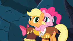 Size: 1280x720 | Tagged: safe, screencap, applejack, chancellor puddinghead, pinkie pie, smart cookie, earth pony, pony, g4, hearth's warming eve (episode), bowtie, cute, diapinkes, duo, duo female, female, hearth's warming eve, hug, jackabetes, mare