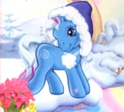 Size: 402x361 | Tagged: safe, snowflake (g3), earth pony, pony, g3, official, backcard, blue coat, flower, hat, outdoors, pom pom, snow, solo, standing, whie mane, winter
