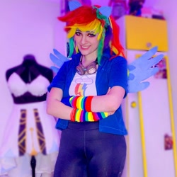 Size: 1080x1080 | Tagged: safe, rainbow dash, human, g4, clothes, cosplay, costume, crossed arms, cutie mark on clothes, goggles, irl, irl human, multicolored hair, photo, rainbow hair, solo