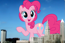 Size: 1347x884 | Tagged: safe, artist:dashiesparkle, artist:thegiantponyfan, pinkie pie, earth pony, pony, g4, cleveland, female, giant pinkie pie, giant pony, giant/macro earth pony, giantess, highrise ponies, irl, looking at you, macro, mare, mega giant, ohio, open mouth, open smile, photo, ponies in real life, raised hoof, smiling, story included