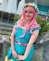 Size: 1080x1350 | Tagged: safe, artist:sweetalissum, fluttershy, human, equestria girls, g4, clothes, cosplay, costume, floral head wreath, flower, fountain, irl, irl human, photo, solo, wondercon