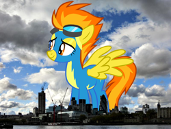 Size: 800x600 | Tagged: safe, artist:issyrael, artist:thegiantponyfan, spitfire, pegasus, pony, g4, clothes, england, female, giant pegasus, giant pony, giant/macro spitfire, giantess, goggles, highrise ponies, irl, london, macro, mare, mega giant, photo, ponies in real life, smiling, spread wings, uniform, united kingdom, wings, wonderbolts uniform