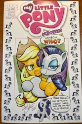 Size: 1362x2048 | Tagged: safe, artist:andypriceart, idw, applejack, rarity, earth pony, pony, unicorn, g4, micro-series #3, my little pony micro-series, andy you magnificent bastard, applejack's hat, bedroom eyes, cowboy hat, duo, eyeshadow, female, freckles, hat, hug, implied appledash, implied lesbian, implied shipping, lesbian, makeup, mare, ship:rarijack, shipping, shipping denied, traditional art
