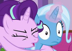 Size: 871x615 | Tagged: safe, screencap, starlight glimmer, trixie, pony, unicorn, all bottled up, g4, season 7, cropped, duo, eyes closed, female, glomp, hug, magic, magic aura, mare, out of context, tackle, wide eyes