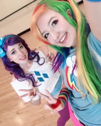 Size: 1080x1350 | Tagged: safe, rainbow dash, rarity, human, g4, clothes, cosplay, costume, cutie mark on clothes, duo, irl, irl human, multicolored hair, peace sign, photo, rainbow hair