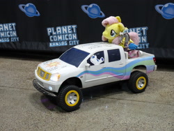 Size: 3648x2736 | Tagged: safe, discord, fluttershy, shining armor, draconequus, pegasus, pony, unicorn, g4, 4de, autograph, convention, female, funko, high res, irl, male, nissan, photo, pickup truck, planet comicon, plushie, toy