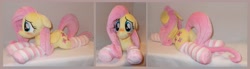Size: 4572x1264 | Tagged: safe, artist:calusariac, fluttershy, pony, g4, blushing, butt, clothes, floppy ears, irl, lying down, photo, plot, plushie, prone, socks, solo, striped socks