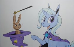 Size: 2048x1321 | Tagged: safe, artist:darkhestur, trixie, pony, rabbit, unicorn, g4, animal, bunny out of the hat, cape, clothes, hat, looking at you, magic trick, magic wand, simple background, smiling, solo, traditional art, trixie's cape, trixie's hat, white background