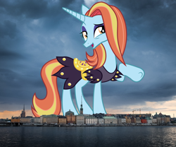 Size: 2048x1700 | Tagged: safe, artist:koolfrood, artist:thegiantponyfan, sassy saddles, pony, unicorn, g4, clothes, female, giant pony, giant unicorn, giantess, highrise ponies, irl, looking at you, macro, mare, mega giant, open mouth, open smile, photo, ponies in real life, raised hoof, skyline, smiling, solo, stockholm, sweden