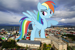 Size: 5700x3800 | Tagged: safe, artist:ashidaru, artist:thegiantponyfan, rainbow dash, pegasus, pony, g4, absurd file size, absurd resolution, female, giant pegasus, giant pony, giantess, grin, highrise ponies, iceland, irl, looking at you, macro, mare, mega giant, mega/giant rainbow dash, photo, ponies in real life, raised hoof, smiling, solo, spread wings, wings
