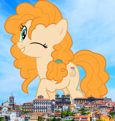 Size: 2658x2808 | Tagged: safe, artist:jhayarr23, artist:thegiantponyfan, pear butter, earth pony, pony, g4, female, giant pony, giant/macro earth pony, giantess, grin, high res, highrise ponies, irl, looking at you, macro, mare, mega giant, one eye closed, photo, ponies in real life, portugal, smiling, solo, wink
