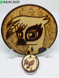 Size: 3000x4000 | Tagged: safe, artist:aracage, gilda, griffon, g4, bust, coaster, eyes closed, irl, keychain, looking at you, photo, portrait, profile, pyrography, traditional art