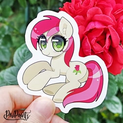 Size: 656x656 | Tagged: safe, artist:piripaints, roseluck, earth pony, pony, g4, butt, ear fluff, female, flower, hand, irl, looking at you, lying down, photo, plant, plot, rosebutt