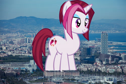 Size: 1920x1280 | Tagged: safe, artist:thebosscamacho, artist:thegiantponyfan, cayenne, pony, unicorn, g4, barcelona, female, giant pony, giant unicorn, giantess, highrise ponies, irl, macro, mare, mega giant, photo, ponies in real life, smiling, spain