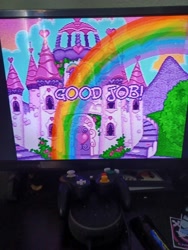Size: 3000x4000 | Tagged: safe, puzzlemint, g3, castle, celebration castle, controller, photo, picture of a screen, rainbow, television, text, video game