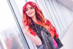 Size: 1080x720 | Tagged: safe, artist:sayakcos, edit, editor:sammykun, faceapp, sunset shimmer, human, equestria girls, g4, blurry background, clothes, cosplay, costume, female, glass, half body, humanized, indoors, irl, irl human, jacket, leather jacket, live action, photo, photography, smiling, solo, wig, window