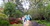 Size: 2097x1080 | Tagged: safe, artist:dashiesparkle, artist:mlplover94, fluttershy, rainbow dash, rarity, pegasus, pony, unicorn, g4, alabama, birmingham, female, garden, irl, looking down, mare, photo, ponies in real life, smiling, spread wings, wings