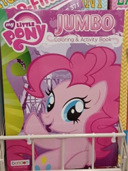 Size: 3000x4000 | Tagged: safe, pinkie pie, earth pony, pony, g4, coloring book, dollar tree, error, female, high res, irl, mare, my little pony jumbo coloring book, my little pony logo, open mouth, open smile, photo, raised hoof, smiling, solo