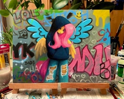 Size: 2048x1639 | Tagged: safe, artist:katputze, fluttershy, pegasus, anthro, g4, clothes, denim, female, graffiti, hand in pocket, hoodie, jeans, mare, pants, photo, ripped jeans, ripped pants, ripping clothes, solo, torn clothes, traditional art