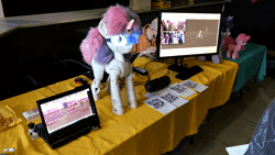 Size: 1920x1080 | Tagged: safe, pinkie pie, sweetie belle, twilight sparkle, earth pony, human, pony, robot, robot pony, sweetie bot project, g4, 3d print, animated, computer, glowing, glowing eyes, glowing horn, goggles, horn, irl, irl human, laptop computer, open mouth, photo, plushie, proto3, safety goggles, sound, sound effects, sweetie bot, technology, webm