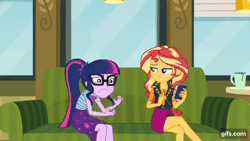 Size: 640x360 | Tagged: safe, screencap, sci-twi, sunset shimmer, twilight sparkle, human, equestria girls, equestria girls series, g4, text support, adorkable, adorkable twilight, animated, boots, bowtie, cellphone, clothes, cute, cutie mark on clothes, dork, duo, duo female, eyes closed, female, geode of empathy, geode of telekinesis, gif, gifs.com, glasses, jewelry, leather, leather boots, leather vest, magical geodes, mug, necklace, open mouth, phone, ponytail, shoes, smartphone, smiling, text support: sunset shimmer