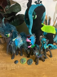 Size: 3024x4032 | Tagged: safe, queen chrysalis, changeling, changeling queen, g4, button, collection, female, figure, idk have fun, irl, merchandise, photo, plushie