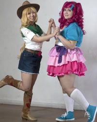 Size: 1080x1351 | Tagged: safe, applejack, pinkie pie, human, equestria girls, g4, clothes, cosplay, costume, duo, irl, irl human, one leg raised, oz comic con, photo