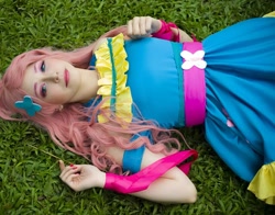 Size: 1080x848 | Tagged: safe, artist:flutterbutter cosplay, kotobukiya, fluttershy, human, g4, clothes, cosplay, costume, irl, irl human, kotobukiya fluttershy, lying down, on back, photo, solo