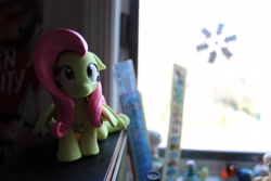 Size: 5184x3456 | Tagged: safe, artist:dustysculptures, fluttershy, pegasus, pony, g4, craft, female, frown, looking up, mare, sculpture, sitting, solo