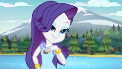 Size: 1920x1080 | Tagged: safe, screencap, rarity, human, equestria girls, g4, my little pony equestria girls: legend of everfree, 1080p, eyebrows, eyeshadow, female, grin, hand on hip, lidded eyes, makeup, mountain, river, smiling, solo, tree, water