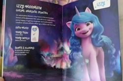 Size: 2048x1355 | Tagged: safe, izzy moonbow, pony, unicorn, g5, my little pony: virtual magic, book, irl, photo