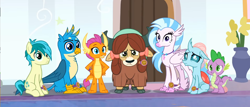 Size: 1194x510 | Tagged: safe, screencap, gallus, ocellus, sandbar, silverstream, smolder, spike, yona, changedling, changeling, classical hippogriff, dragon, earth pony, griffon, hippogriff, pony, yak, a matter of principals, g4, season 8, bow, cloven hooves, colored hooves, confused, cropped, hair bow, hand on hip, jewelry, looking at you, monkey swings, necklace, reaction image, student six, winged spike, wings