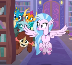 Size: 546x494 | Tagged: safe, screencap, gallus, ocellus, sandbar, silverstream, smolder, yona, changedling, changeling, classical hippogriff, dragon, earth pony, griffon, hippogriff, pony, yak, g4, what lies beneath, bookshelf, bow, cropped, flying, hair bow, jewelry, monkey swings, necklace, spread wings, student six, wings