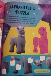 Size: 1960x2940 | Tagged: safe, alphabittle blossomforth, pony, unicorn, g5, 2022, annual, book, full name, irl, name, photo