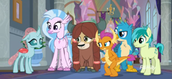 Size: 1593x731 | Tagged: safe, screencap, gallus, ocellus, sandbar, silverstream, smolder, yona, changedling, changeling, classical hippogriff, dragon, earth pony, griffon, hippogriff, pony, yak, g4, school daze, cloven hooves, cropped, jewelry, necklace, student six