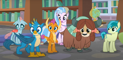 Size: 1502x738 | Tagged: safe, screencap, gallus, ocellus, sandbar, silverstream, smolder, yona, changedling, changeling, classical hippogriff, dragon, earth pony, griffon, hippogriff, pony, yak, g4, what lies beneath, bookshelf, bow, cloven hooves, cropped, dragoness, female, globe, hair bow, jewelry, monkey swings, necklace, offscreen character, student six
