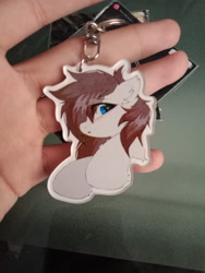 Size: 3120x4160 | Tagged: safe, artist:rieyadraws, oc, oc only, oc:jet blast, pegasus, pony, chest fluff, ear fluff, hoof fluff, irl, keychain, looking at you, photo, raised hoof, solo, worried