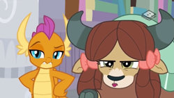 Size: 1249x703 | Tagged: safe, screencap, smolder, yona, dragon, yak, g4, the hearth's warming club, bow, cloven hooves, dragoness, duo, female, hair bow, hand on hip, monkey swings, raised eyebrow, smolder is not amused, unamused, yona is not amused