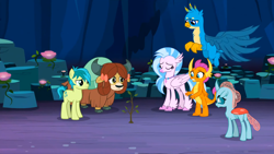 Size: 1600x900 | Tagged: safe, screencap, gallus, ocellus, sandbar, silverstream, smolder, yona, changedling, changeling, classical hippogriff, dragon, earth pony, griffon, hippogriff, pony, yak, g4, uprooted, bow, cloven hooves, colored hooves, eyes closed, hair bow, jewelry, monkey swings, necklace, student six